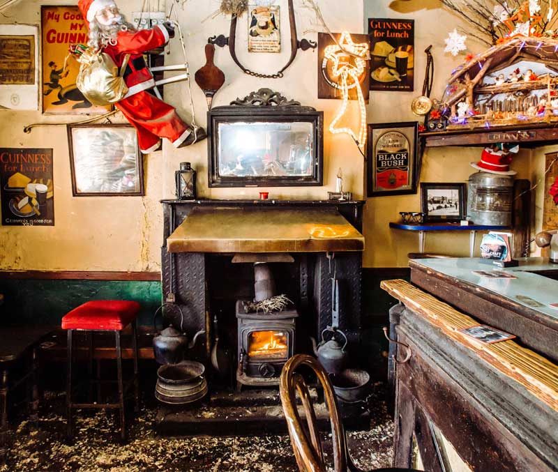 Inside The Shanty Bar, with shelves of antiques and pictures covering the walls