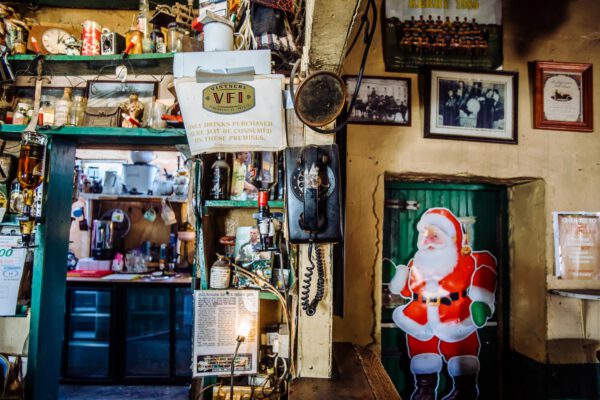 Framed photographs and memorabilia filling a corner of the snug