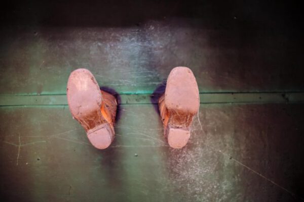 A pair of pink slippers left on the pub floor